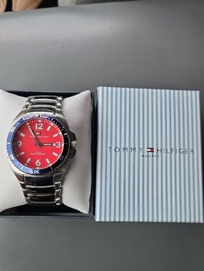 Tommy Hilfiger Red Dial Watch with Blue Bezel and Silver Bracelet